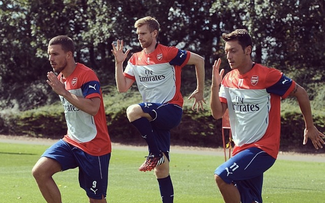 Lukas Podolski Per Mertesacker Mesut Ozil Arsenal