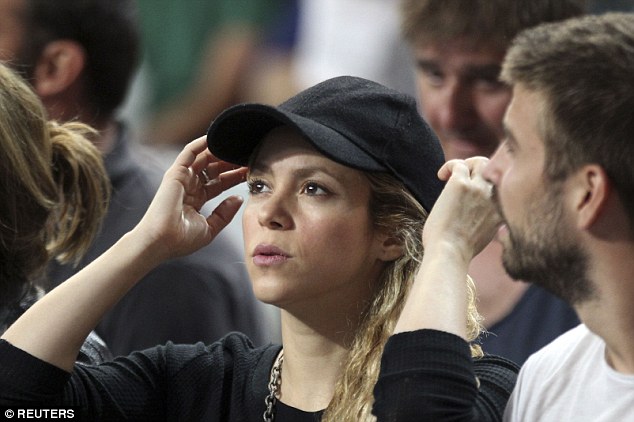 Shakira and Gerard Pique at a basketball game in Barcelona