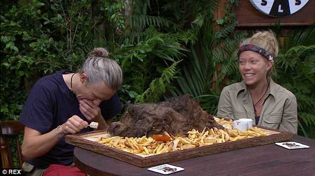 Jimmy Bullard eating camel's hump next to Kendra Wilkinson