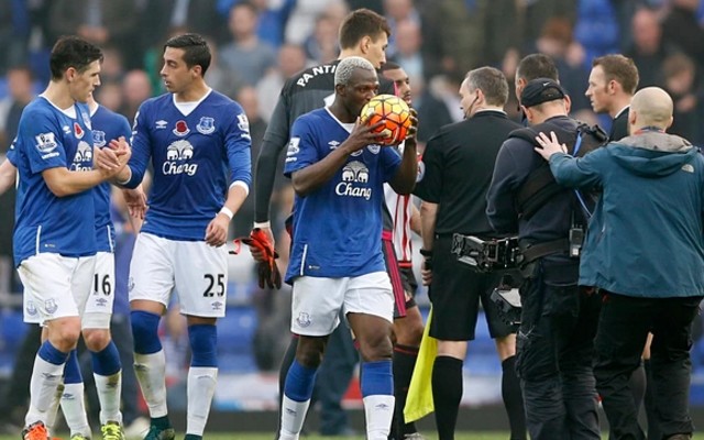 Gareth Barry shakes hands and Arouna Kone kisses the ball