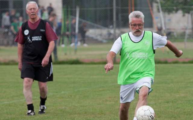 Old men playing soccer