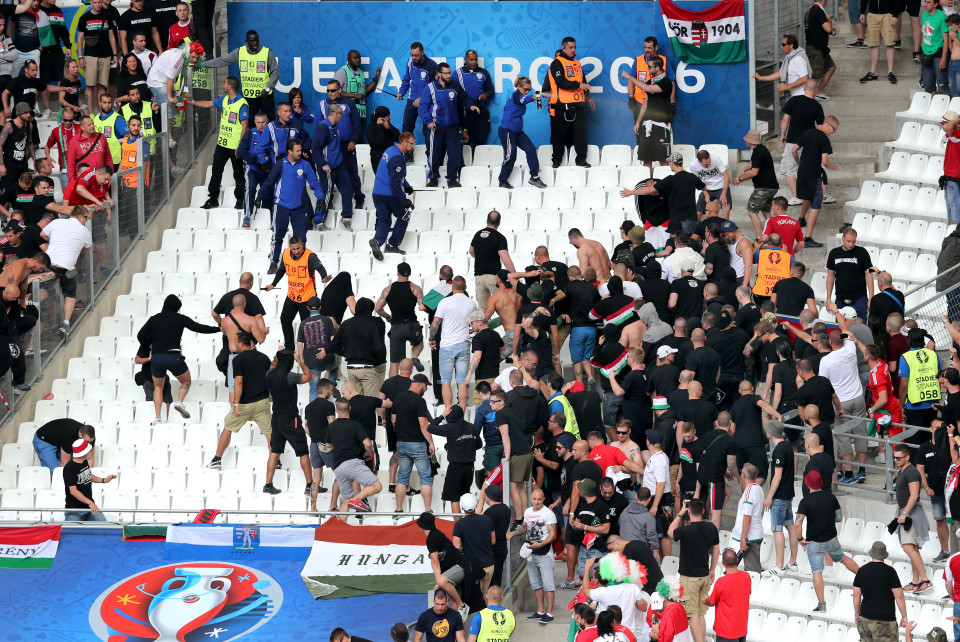 Supporters of Hungary and police officers clash in the stands prior to the Euro 2016 Group F soccer match between Iceland and Hungary at the Velodrome stadium in Marseille, France, Saturday, June 18, 2016. (AP Photo/Claude Paris)