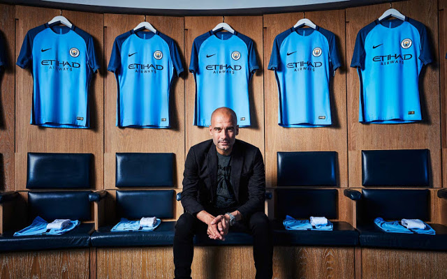 Man City home kit with Pep Guardiola