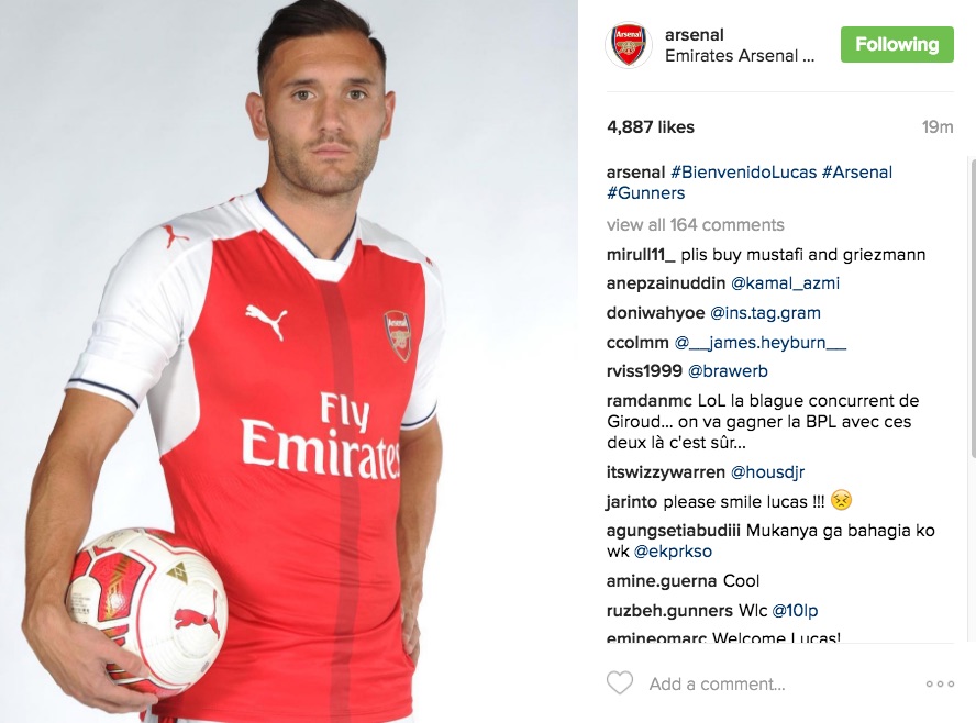 Lucas Perez sad in Arsenal signing photo