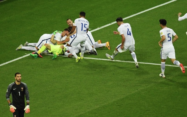 Chile players jump on Claudio Bravo after Confederations Cup penalty shootout