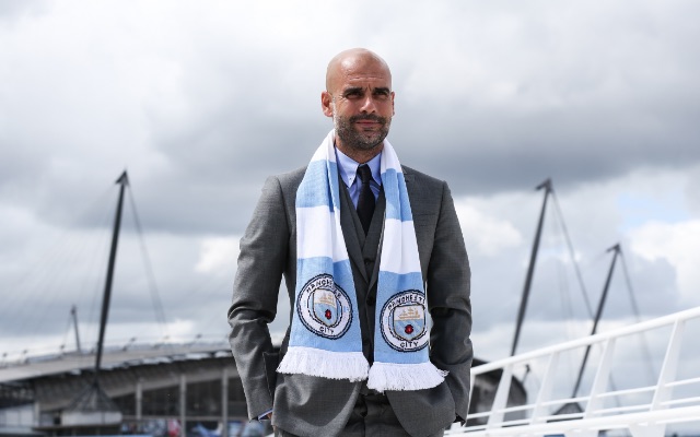Pep Guardiola in Man City scarf
