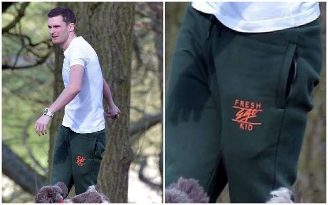 Adam-Johnson-wears-Fresh-Ego-Kid-while-walking-dog-in-park