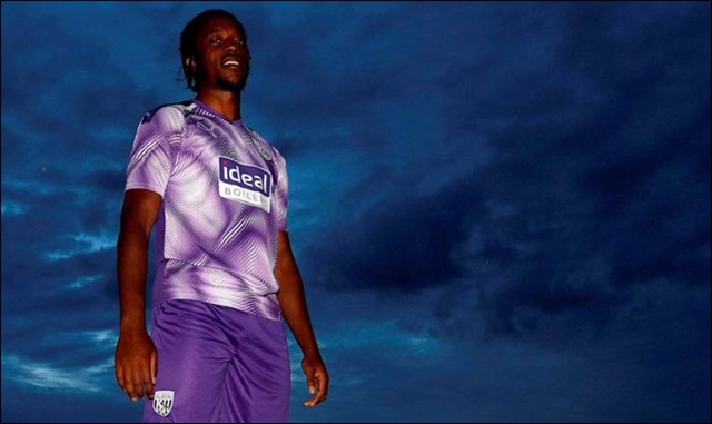 Romaine Sawyers models the new West Bromwich Albion Third shirt