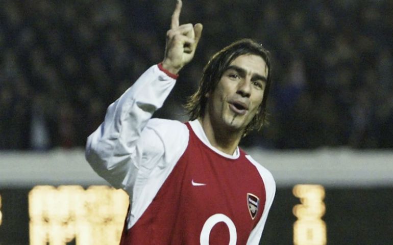 Robert Pires celebrates during an Arsenal match