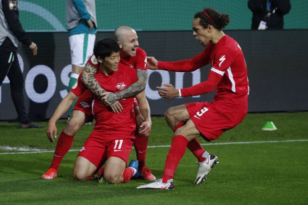 Hwang Hee-Chan celebrates with Angelino and Poulsen for RB Leipzig