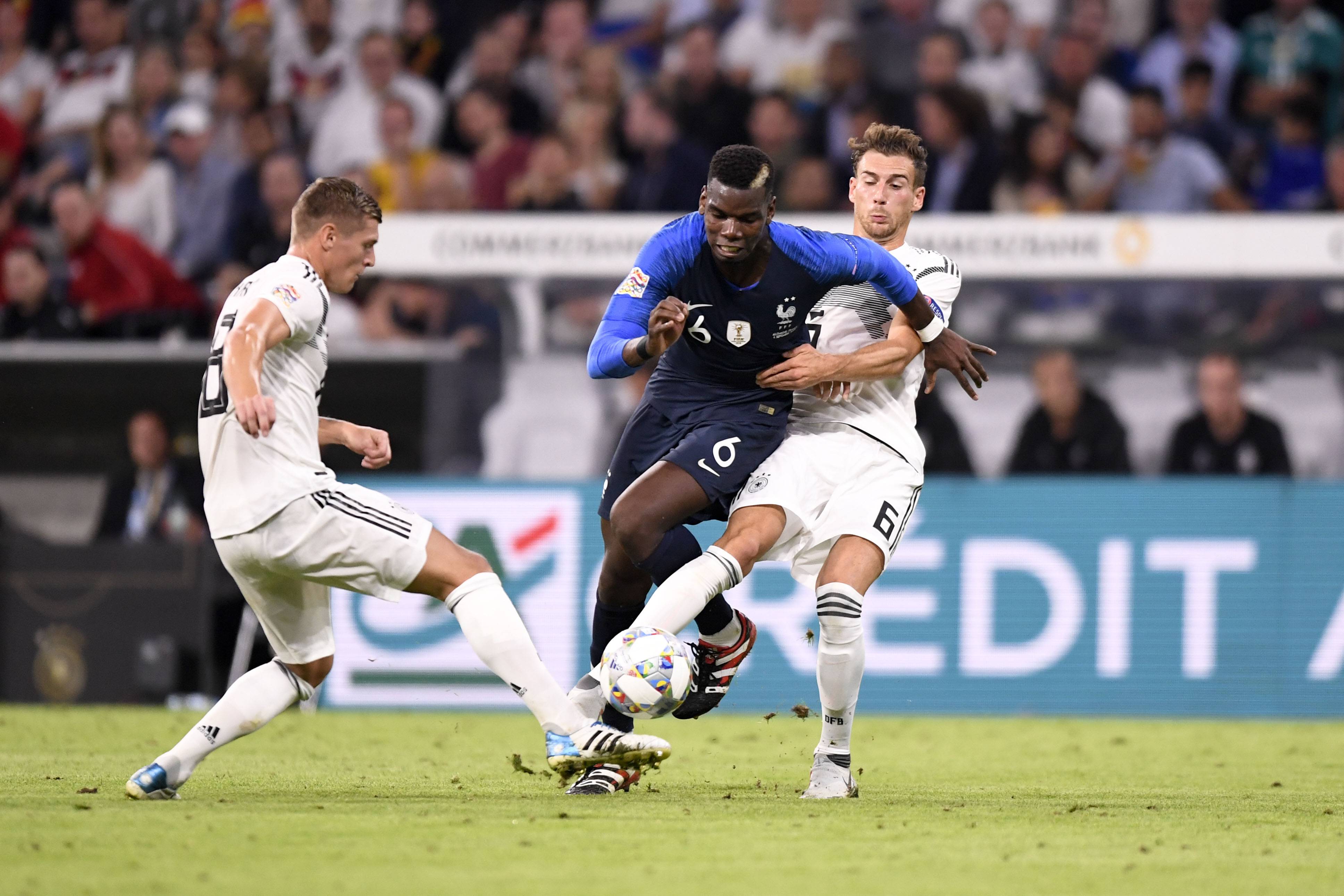 Leon Goretzka and Toni Kroos battle Paul Pogba