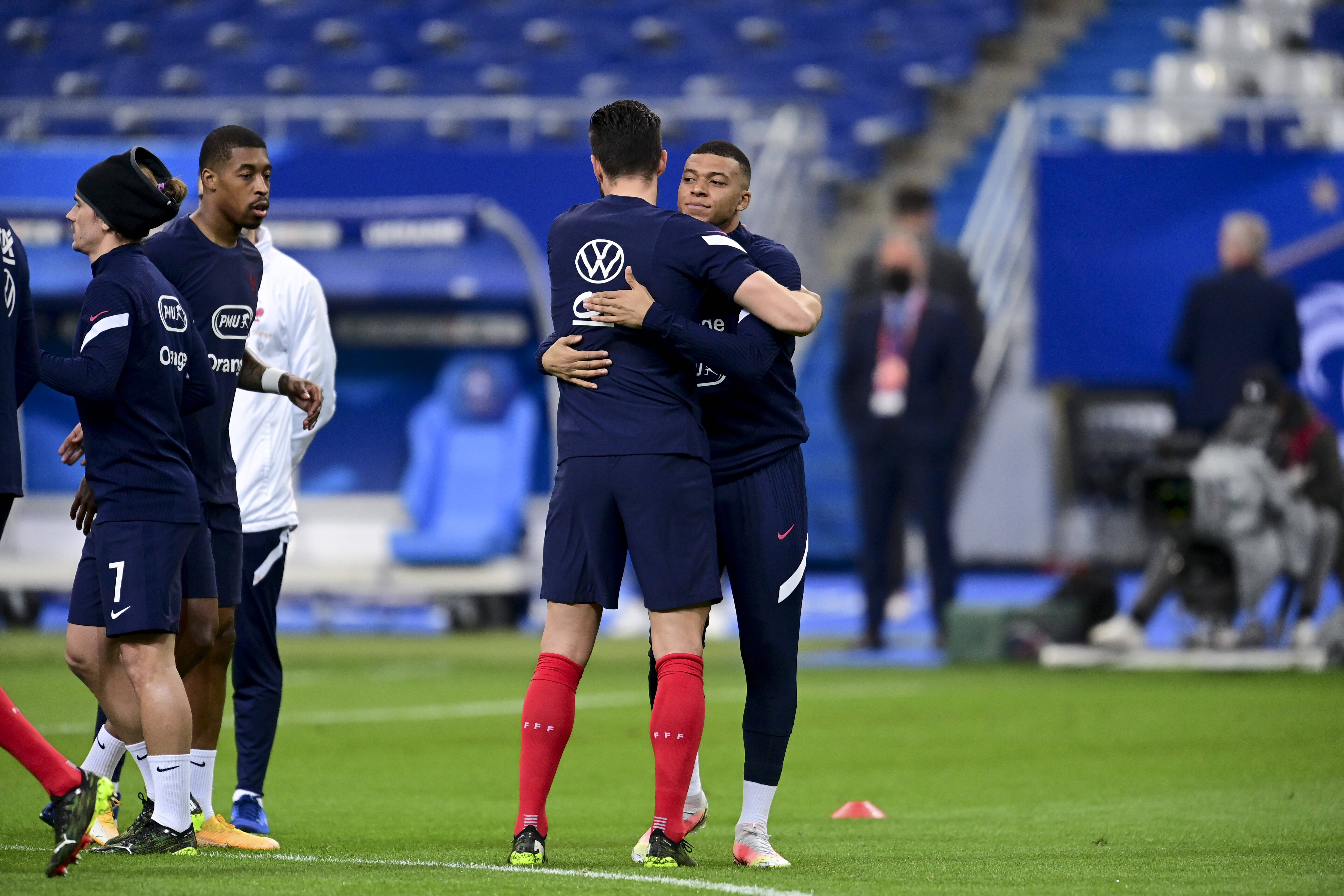 Olivier Giroud and Kylian Mbappe hug for France