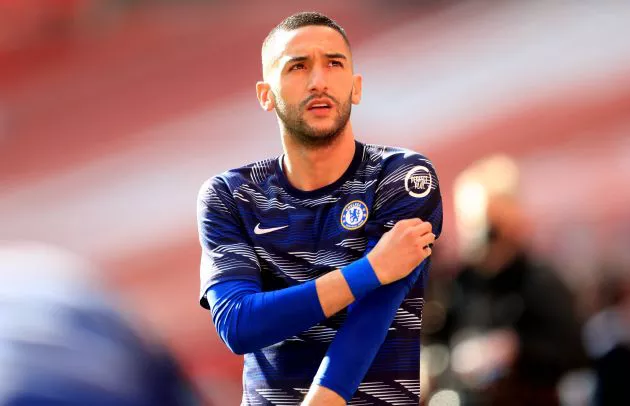 Hakim Ziyech looks out during pre-match training for Chelsea