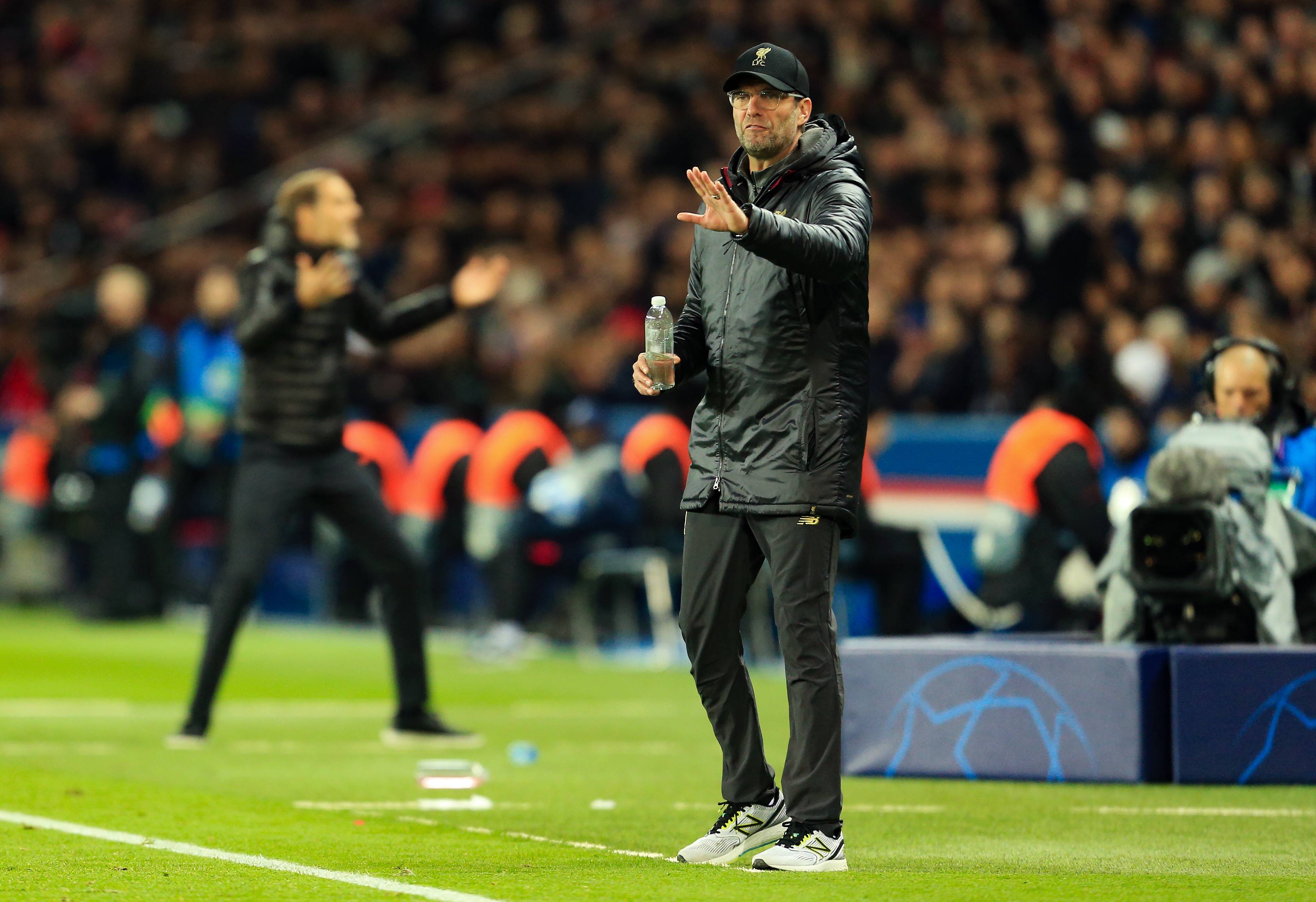 Jurgen Klopp with Thomas Tuchel in background during Liverpool vs PSG