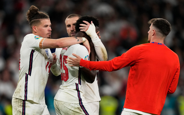 Luke Shaw hugs Bukayo Saka