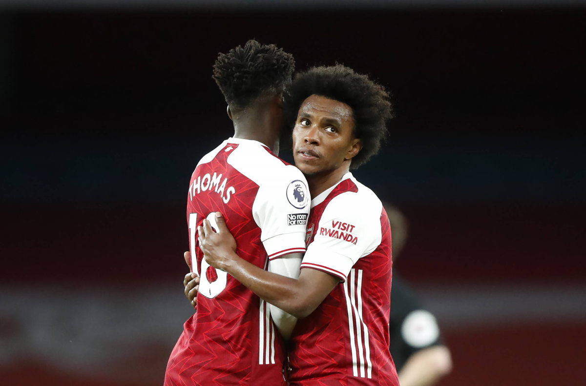 Willian hugs Partey for Arsenal