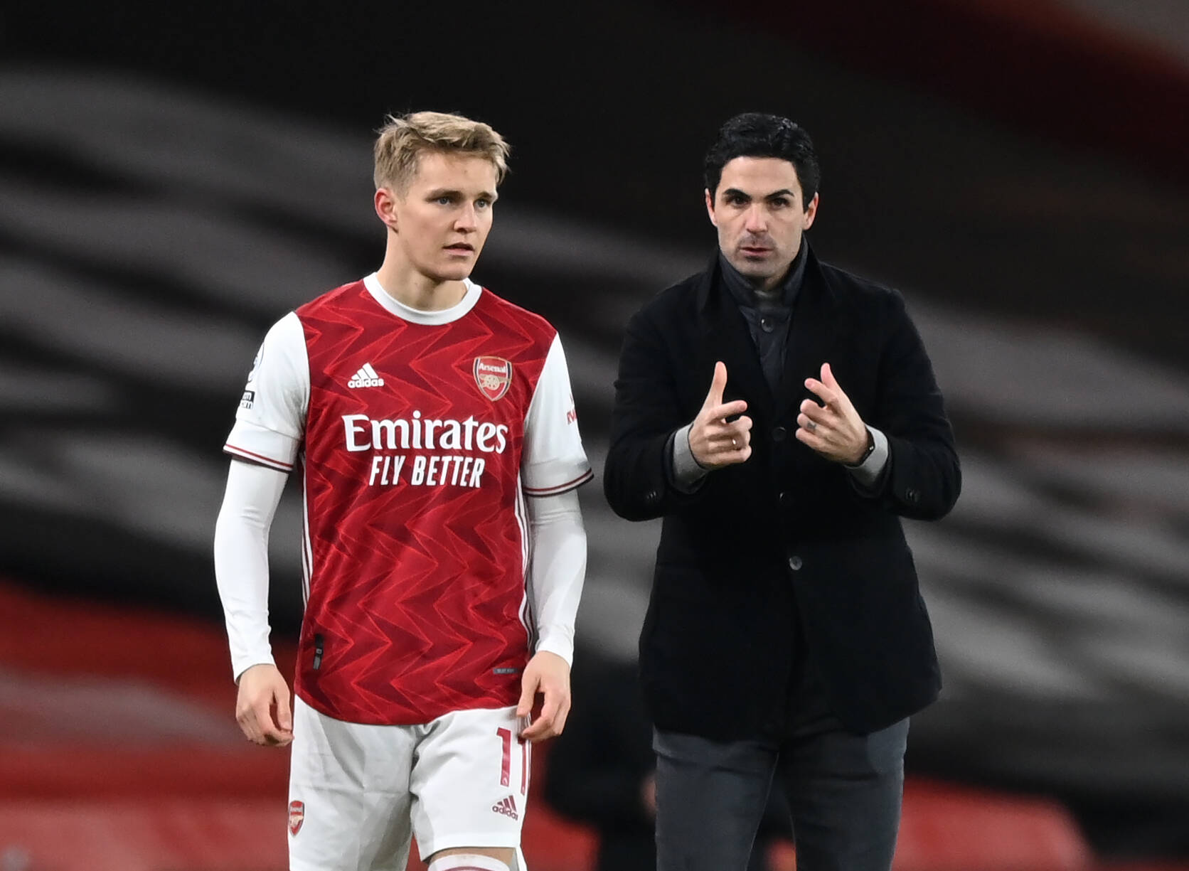 Martin Odegaard and Mikel Arteta of Arsenal