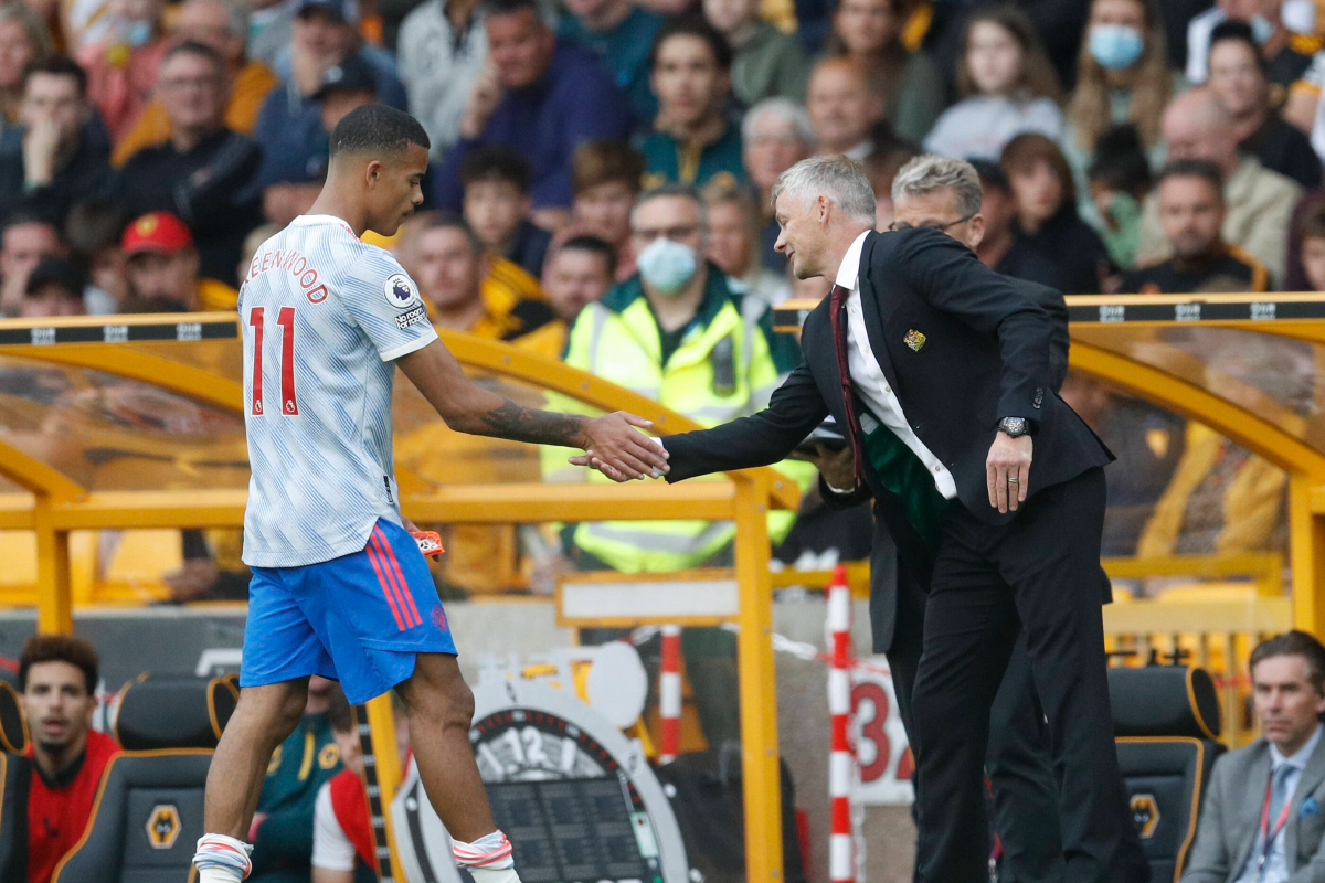 Solskjaer shakes hand of Mason Greenwood