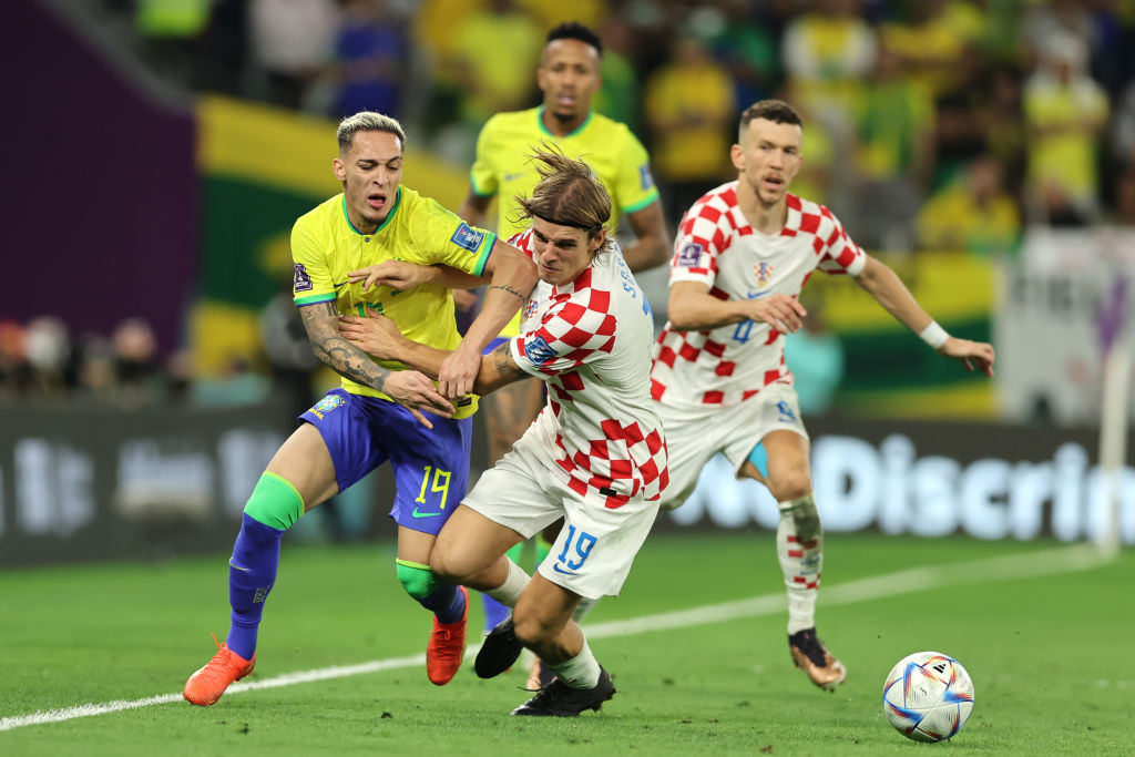Antony of Brazil competes with Borna Sosa of Croatia