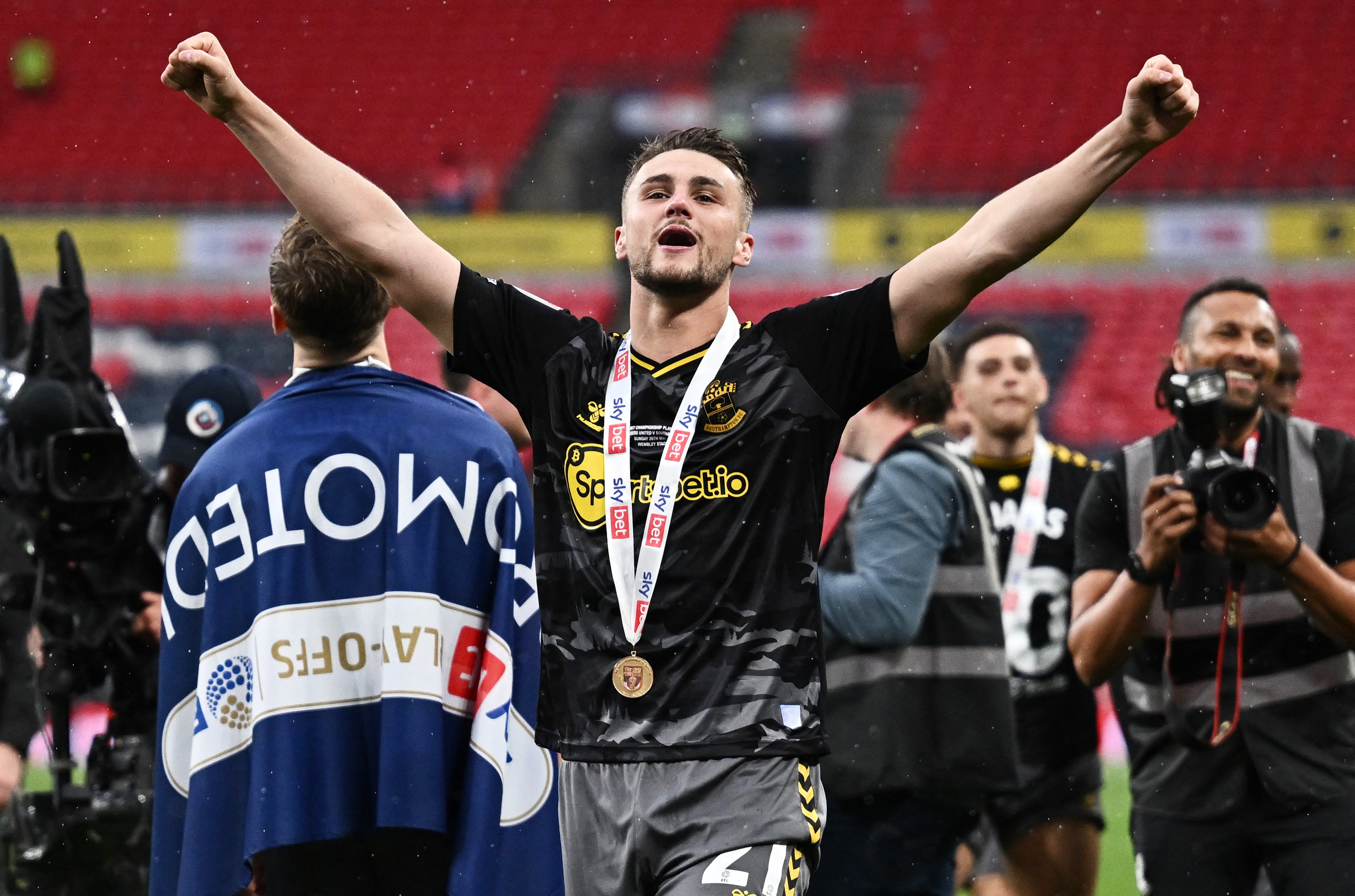 Taylor Harwood-Bellis celebrates promotion.