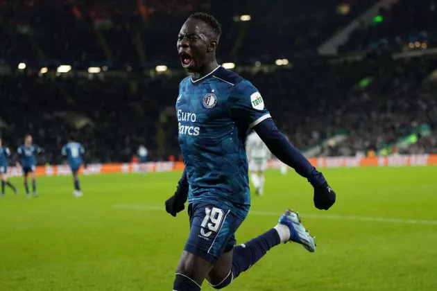 Feyenoord's Gambian forward #19 Yankuba Minteh celebrates after scoring his team first goal during the UEFA Champions League group E football match between Celtic and Feyenoord at Celtic Park stadium in Glasgow on December 13, 2023.