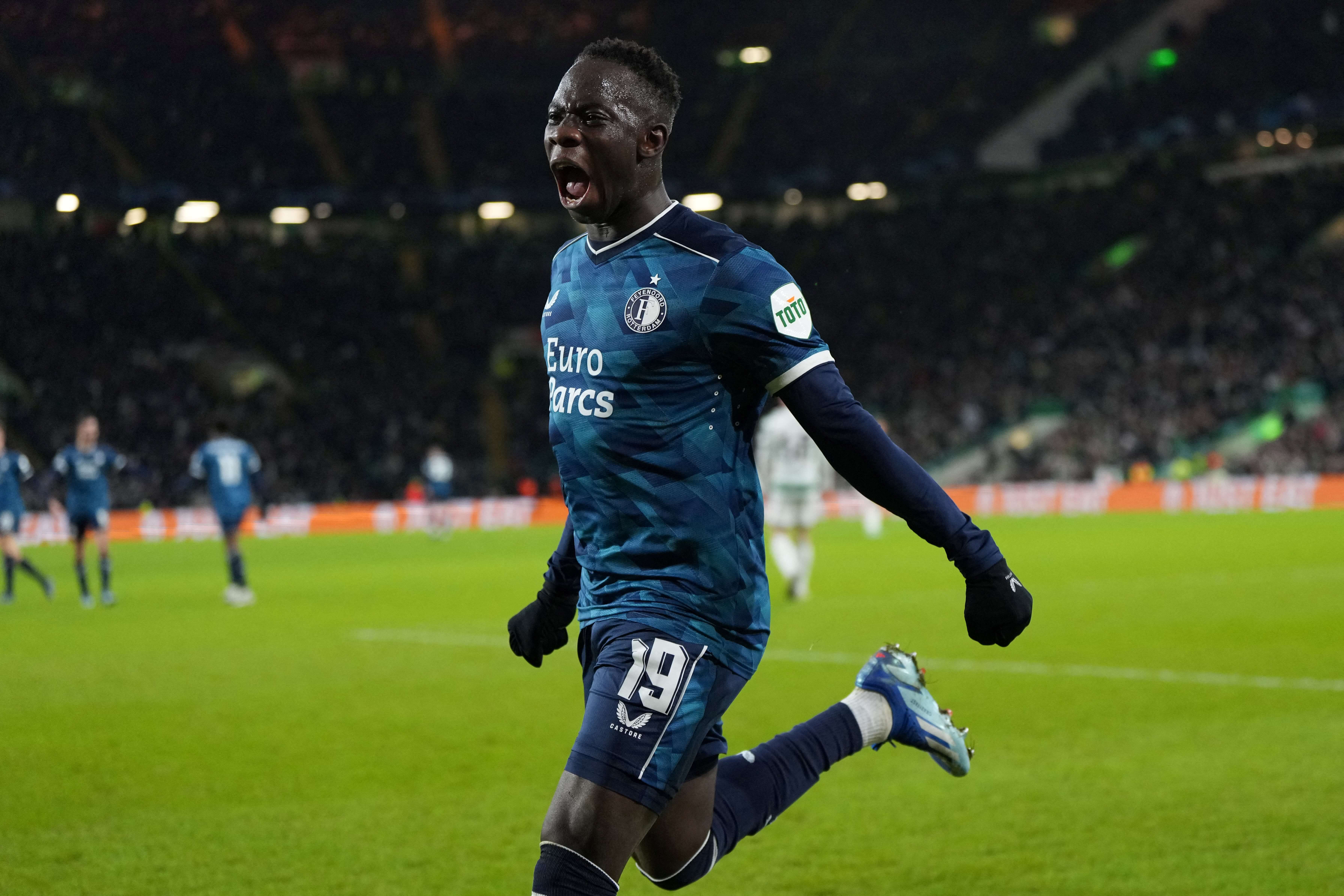 Feyenoord's Gambian forward #19 Yankuba Minteh celebrates after scoring his team first goal during the UEFA Champions League group E football match between Celtic and Feyenoord at Celtic Park stadium in Glasgow on December 13, 2023.