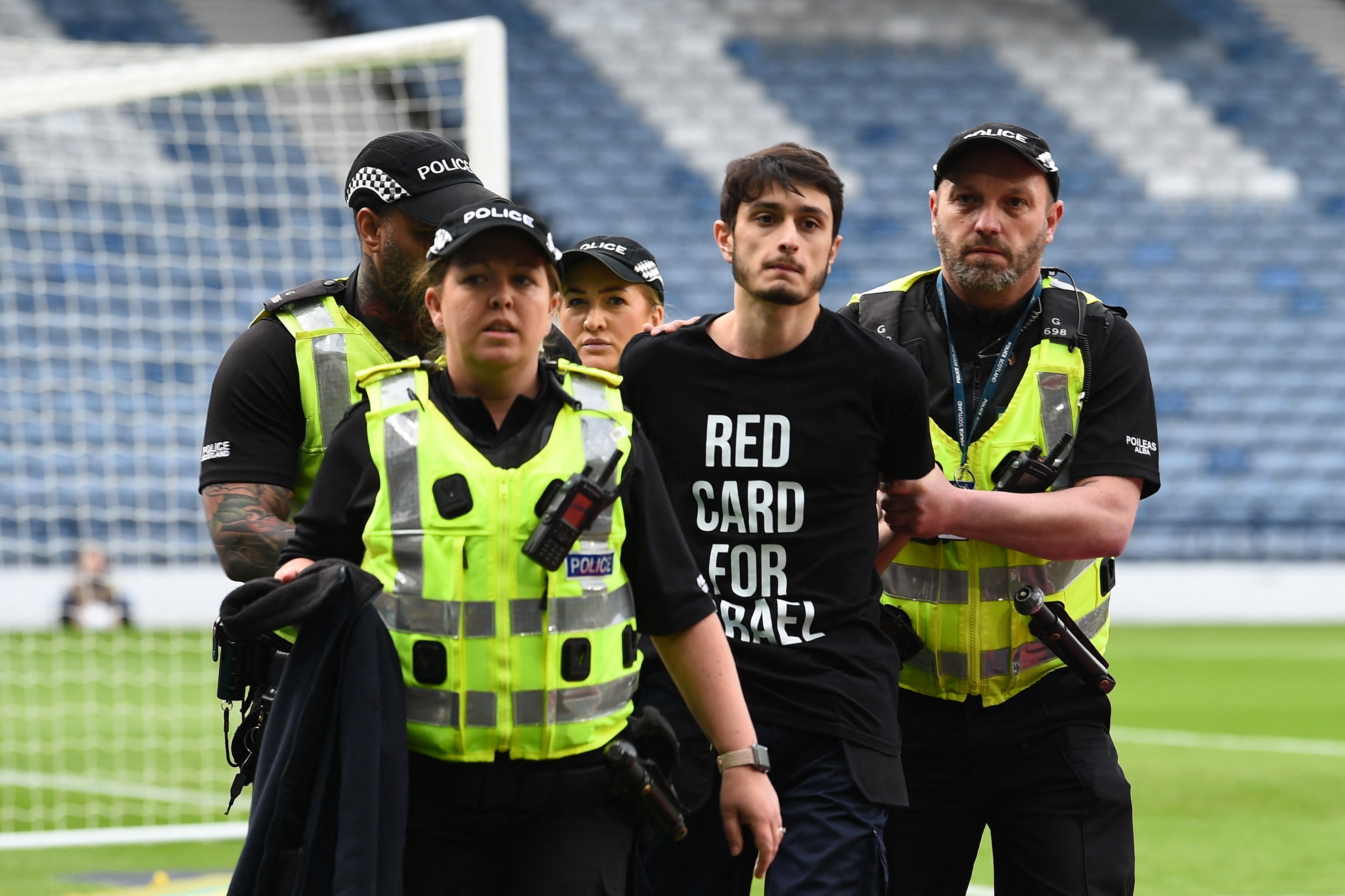 A demonstrator wearing a t-shirt reading A demonstrator wearing a t-shirt reading