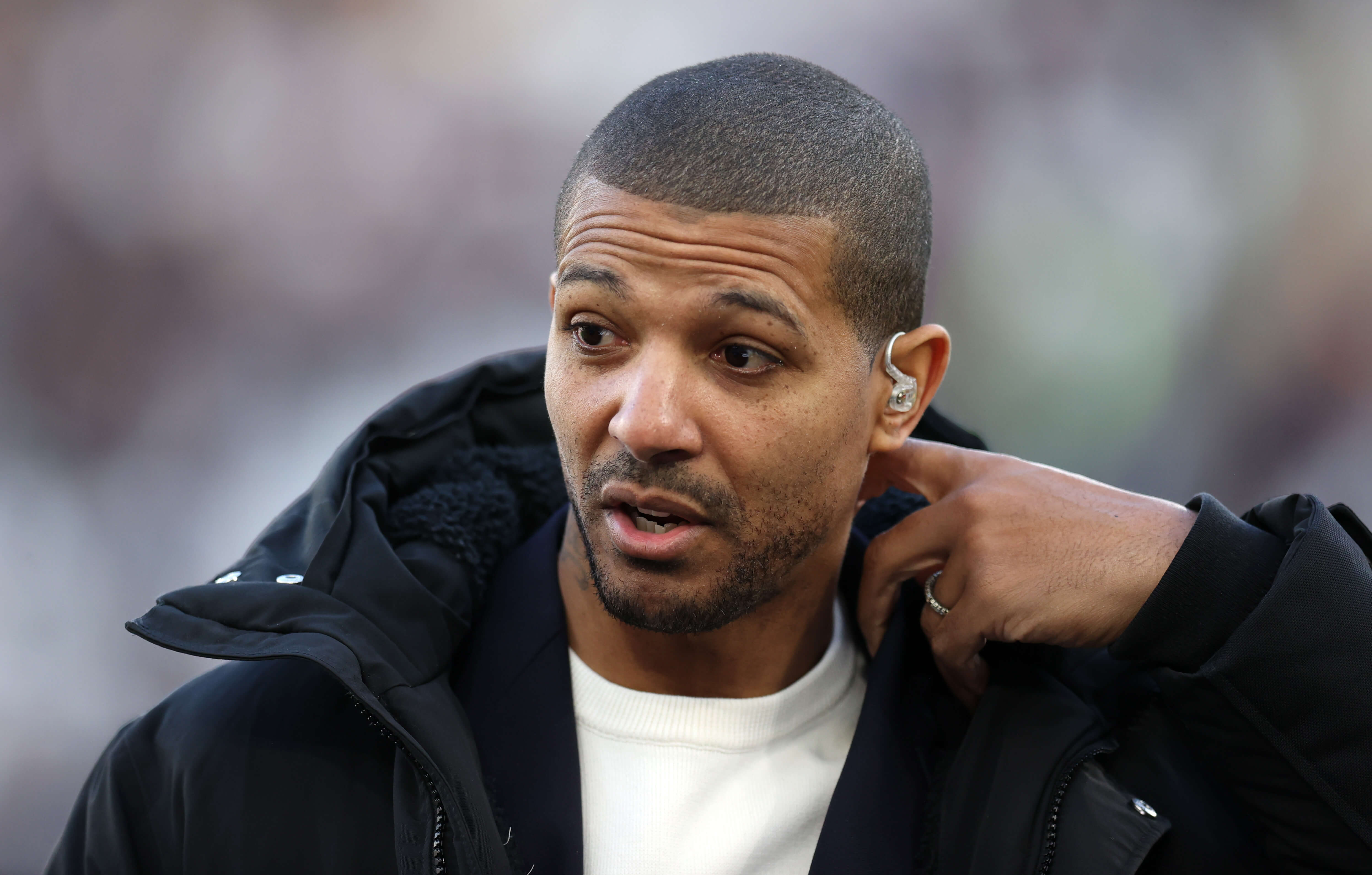 Former Leeds United player Jermaine Beckford is interviewed before the match during the Emirates FA Cup Third Round match between West Ham United and Leeds United at London Stadium on January 09, 2022 in London, England.
