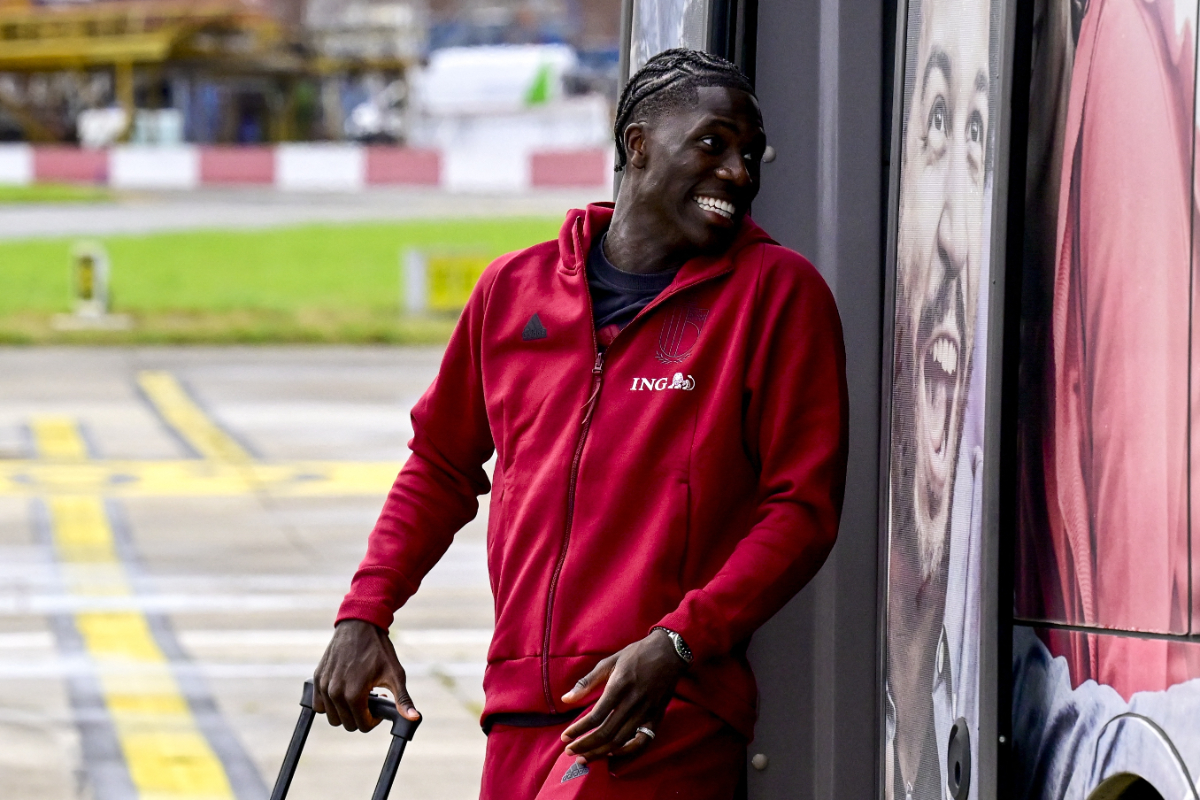 Belgium's midfielder Amadou Onana boards an aircraft with teammates at Brussels International Airport, Zaventem on June 12, 2024, as the Belgian national football team travel to Germany for the Euro 2024 European football Championships where they will play in Group F. Arsenal and Man United want to sign Amadou Onana.