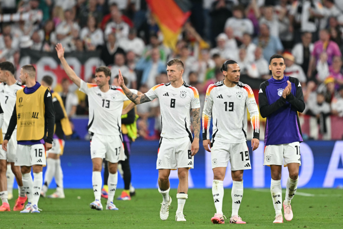 Germany's midfielder #08 Toni Kroos, Germany's midfielder #19 Leroy Sane and Germany's midfielder #10 Jamal Musiala (R) celebrate after winning the UEFA Euro 2024 Group A football match between Germany and Scotland at the Munich Football Arena in Munich on June 14, 2024.