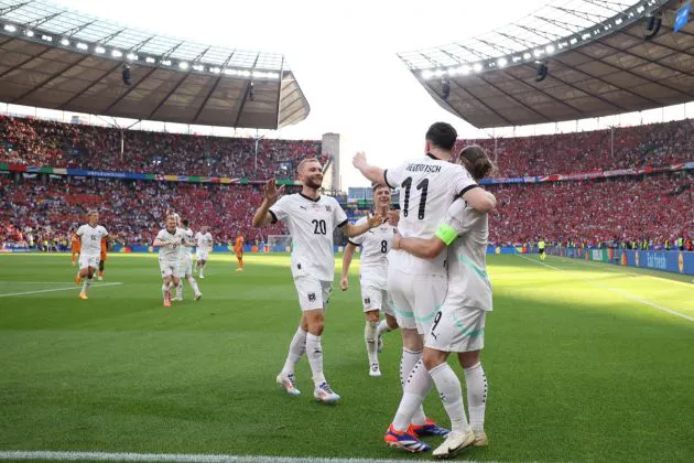 Austria's midfielder #09 Marcel Sabitzer celebrates scoring his team's third goal with his teammates during the UEFA Euro 2024 Group D football match between the Netherlands and Austria at the Olympiastadion in Berlin on June 25, 2024.