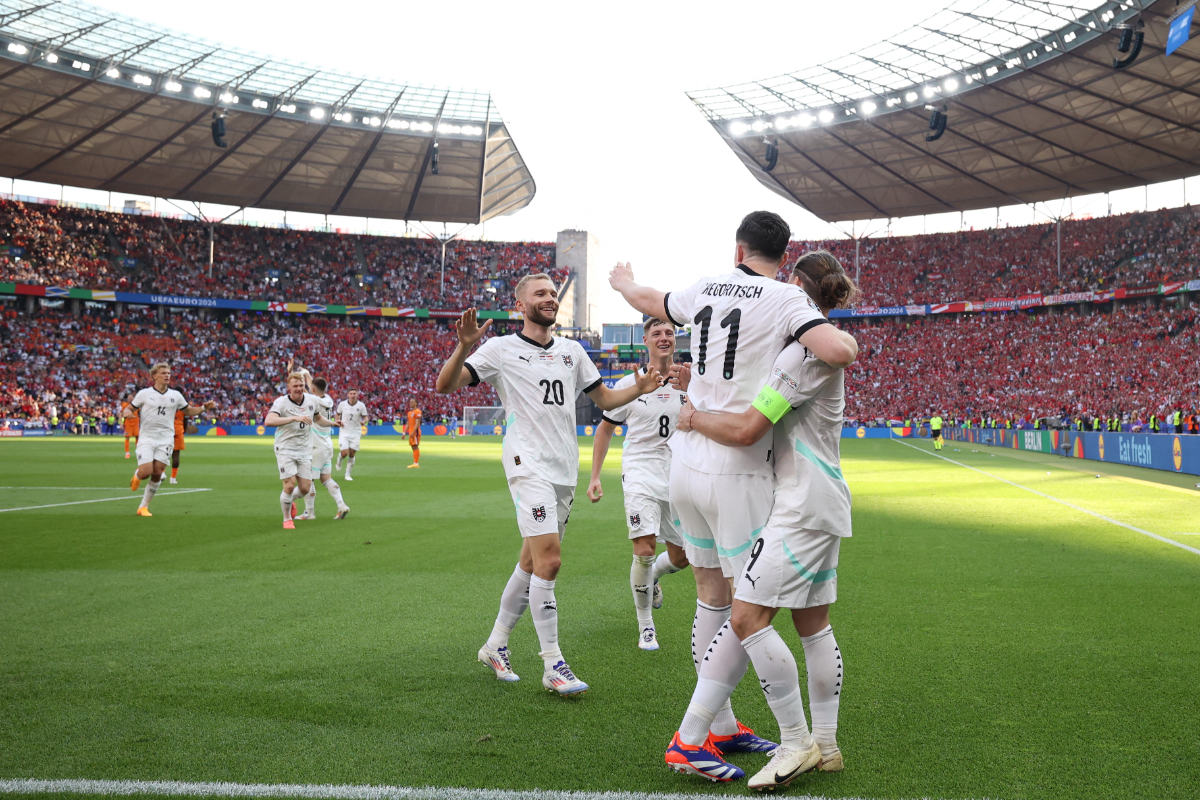Austria's midfielder #09 Marcel Sabitzer celebrates scoring his team's third goal with his teammates during the UEFA Euro 2024 Group D football match between the Netherlands and Austria at the Olympiastadion in Berlin on June 25, 2024.