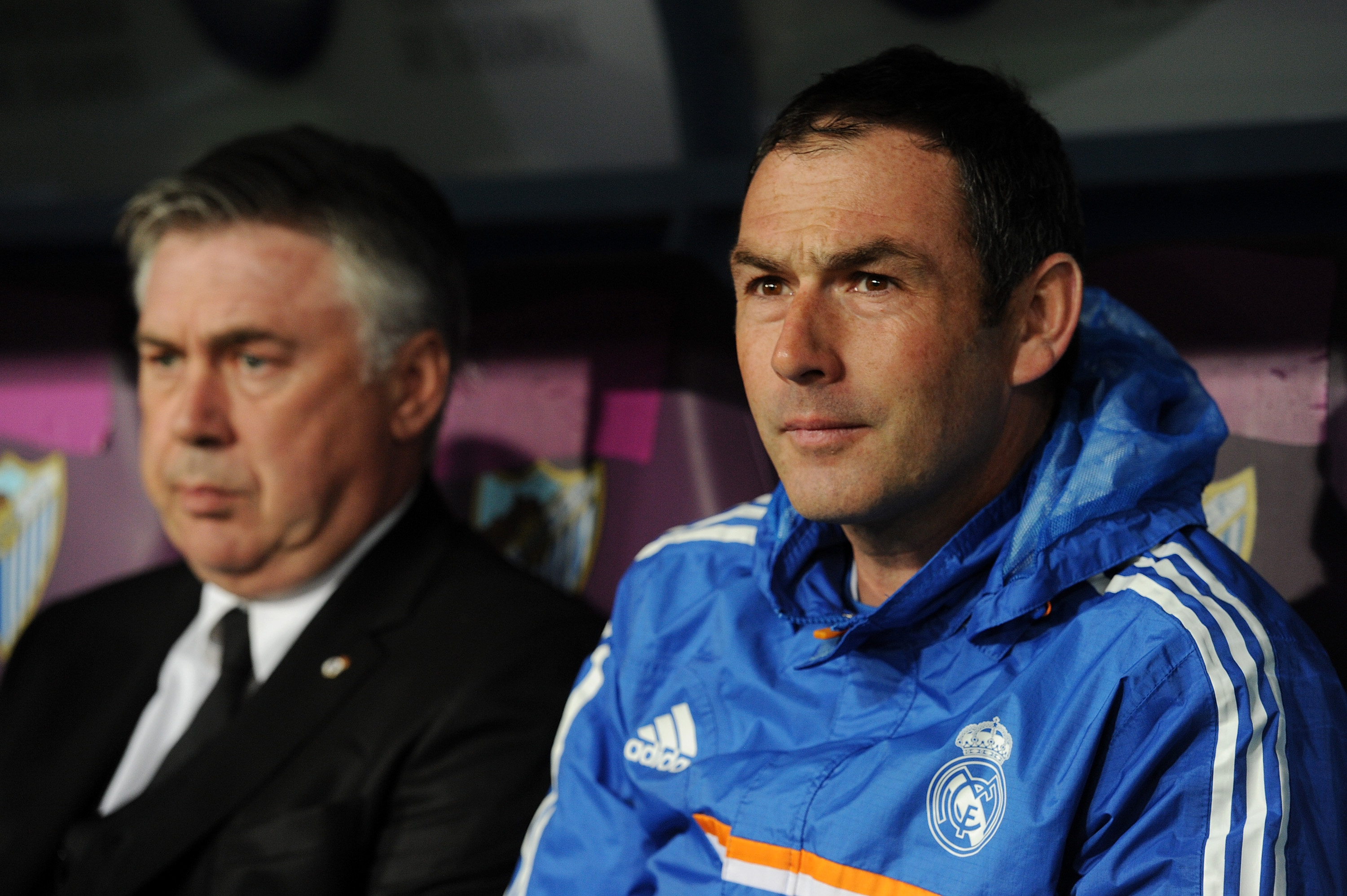 Assistant coach Paul Clement (R) sits beside head coach Carlo Ancelotti of Real Madrid FC during the La Liga match between Malaga and Real Madrid at La Rosaleda Stadium on March 15, 2014 in Malaga, Spain.