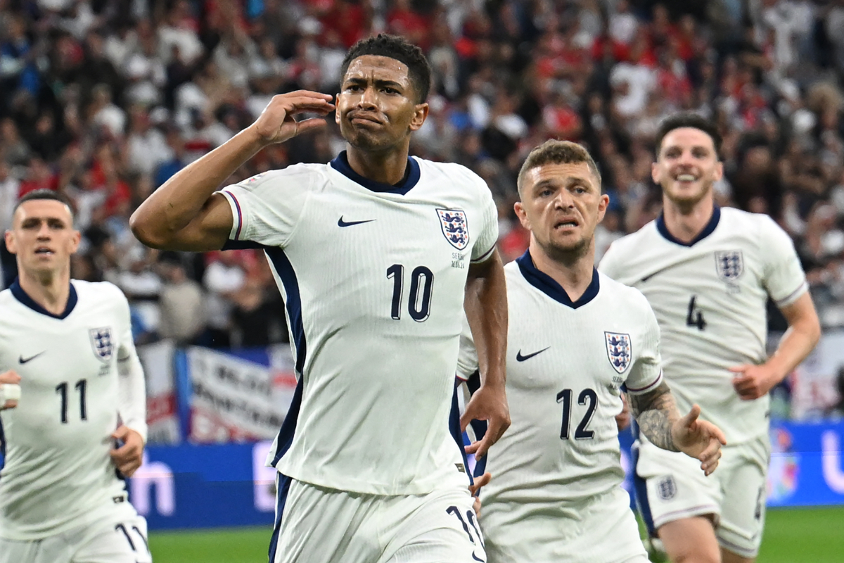 Jude Bellingham celebrates scoring his team's first goal during the UEFA Euro 2024 Group C football match between Serbia and England at the Arena AufSchalke in Gelsenkirchen on June 16, 2024.