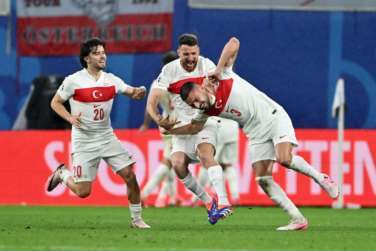 Merih Demiral of Turkiye celebrates scoring his team's second goal with teammates Ferdi Kadioglu and Salih Ozcan during the UEFA EURO 2024 round of 16 match between Austria and Turkiye at Football Stadium Leipzig