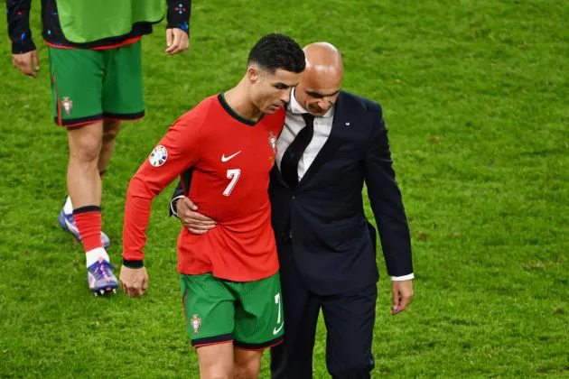 Cristiano Ronaldo of Portugal interacts with Roberto Martinez, Head Coach of Portugal, following defeat in the penalty shootout after the UEFA EURO 2024 quarter-final match between Portugal and France at Volksparkstadion on July 05, 2024.
