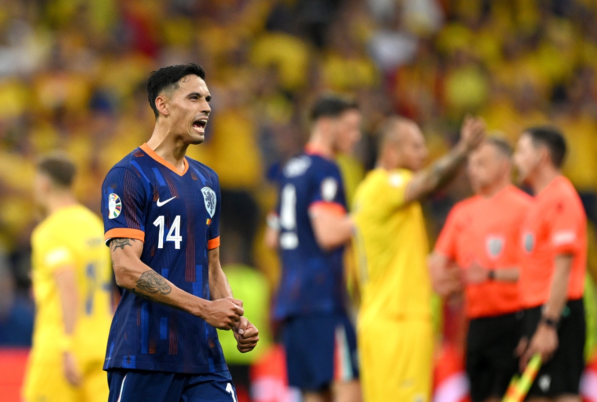 Tijjani Reijnders of the Netherlands celebrates victory after the UEFA EURO 2024 round of 16 match between Romania and Netherlands at Munich Football Arena on July 02, 2024 in Munich, Germany.