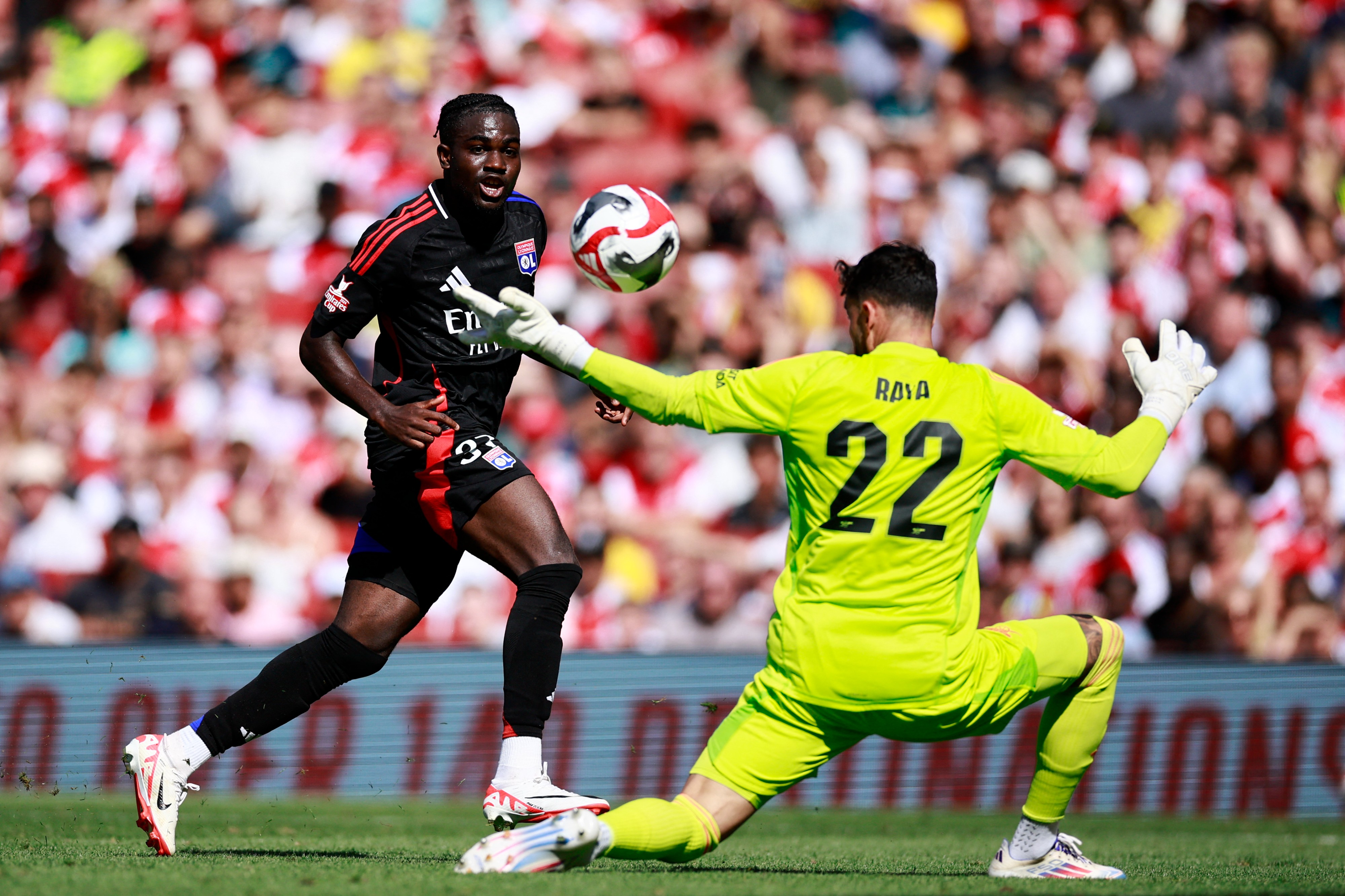 Ernest Nuamah in action for Lyon against Arsenal