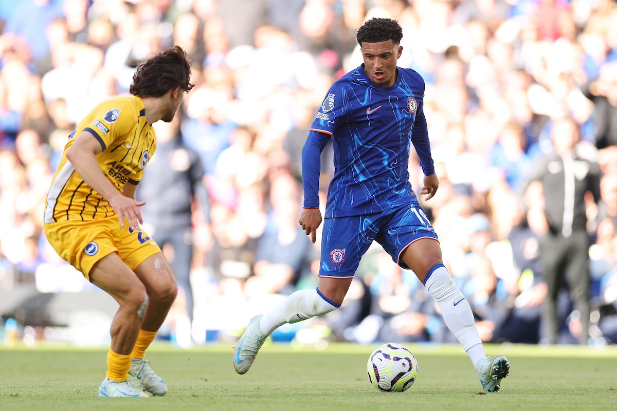 Jadon Sancho of Chelsea is challenged by Ferdi Kadioglu of Brighton