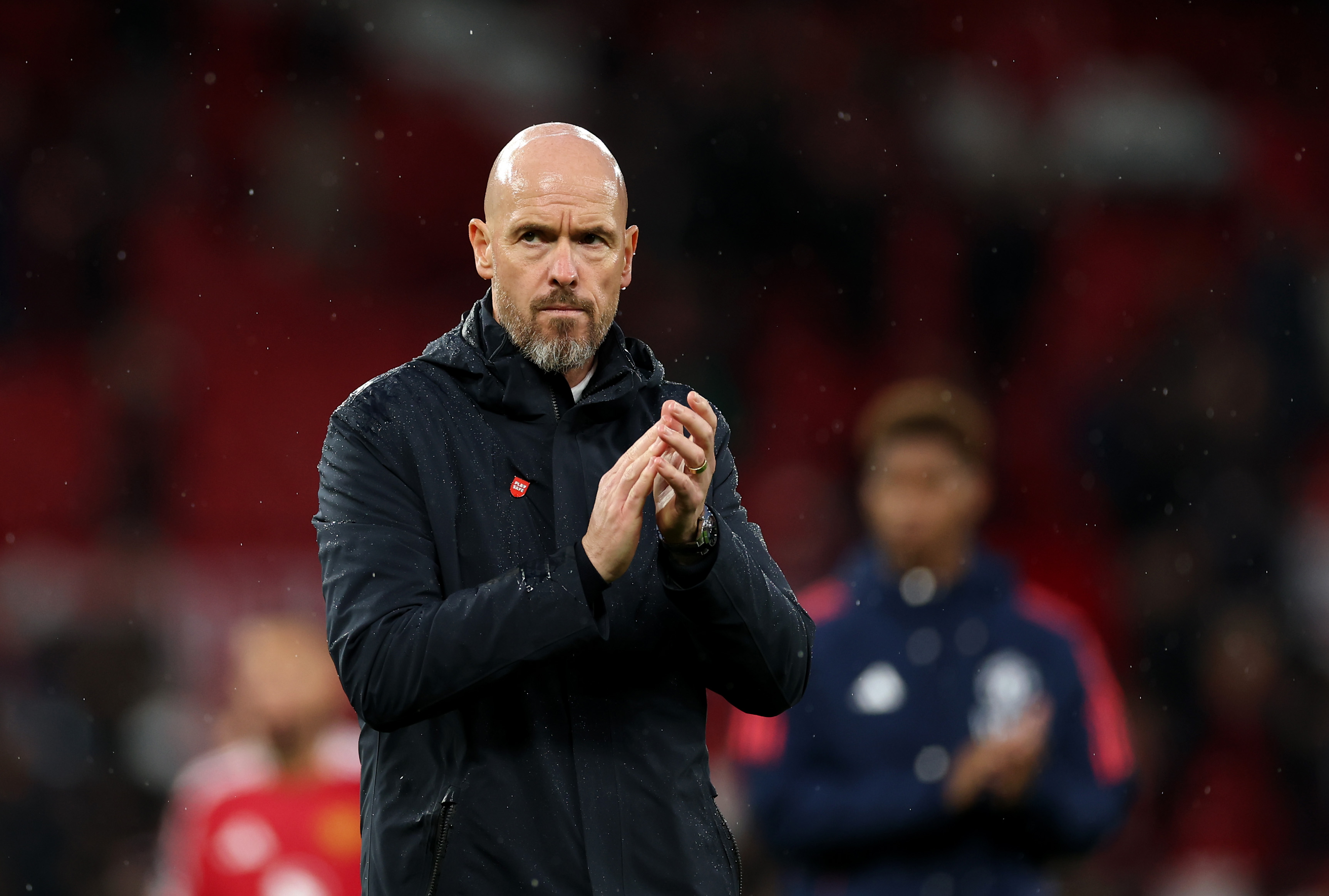 Erik ten Hag applauds Man United fans. Erik ten Hag applauds Man United fans.