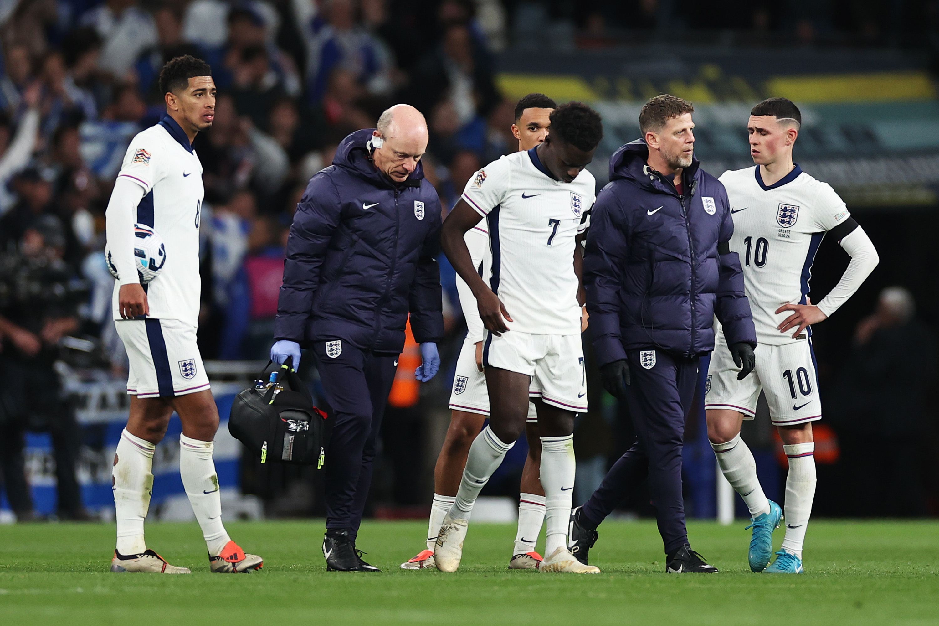 Arsenal forward Bukayo Saka limps out of England's Nations League clash with Greece.