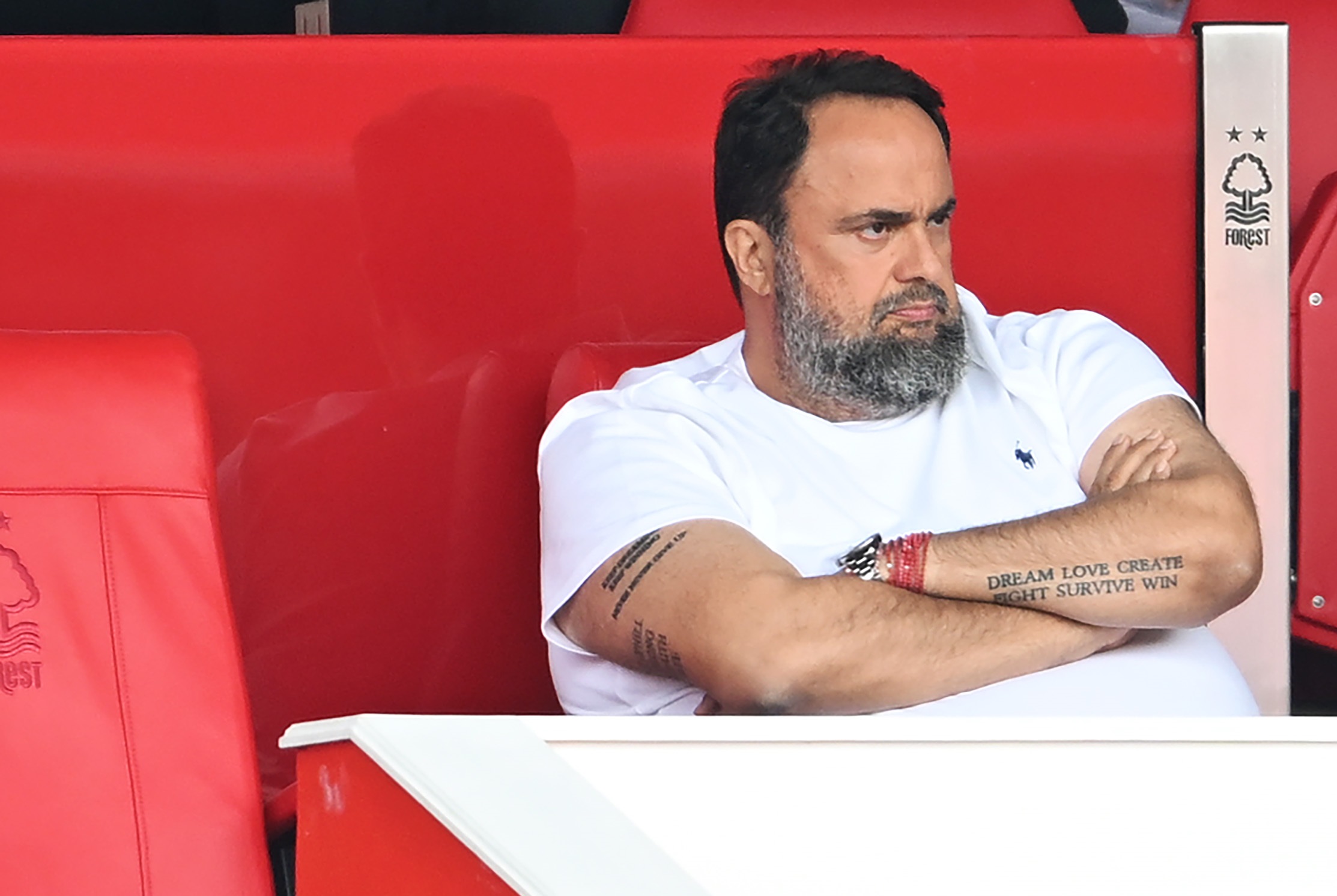 Evangelos Marinakis watches the game