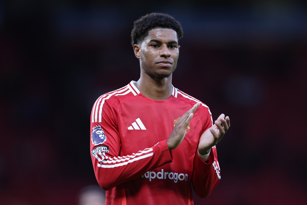 Man United striker Marcus Rashford claps the fans.