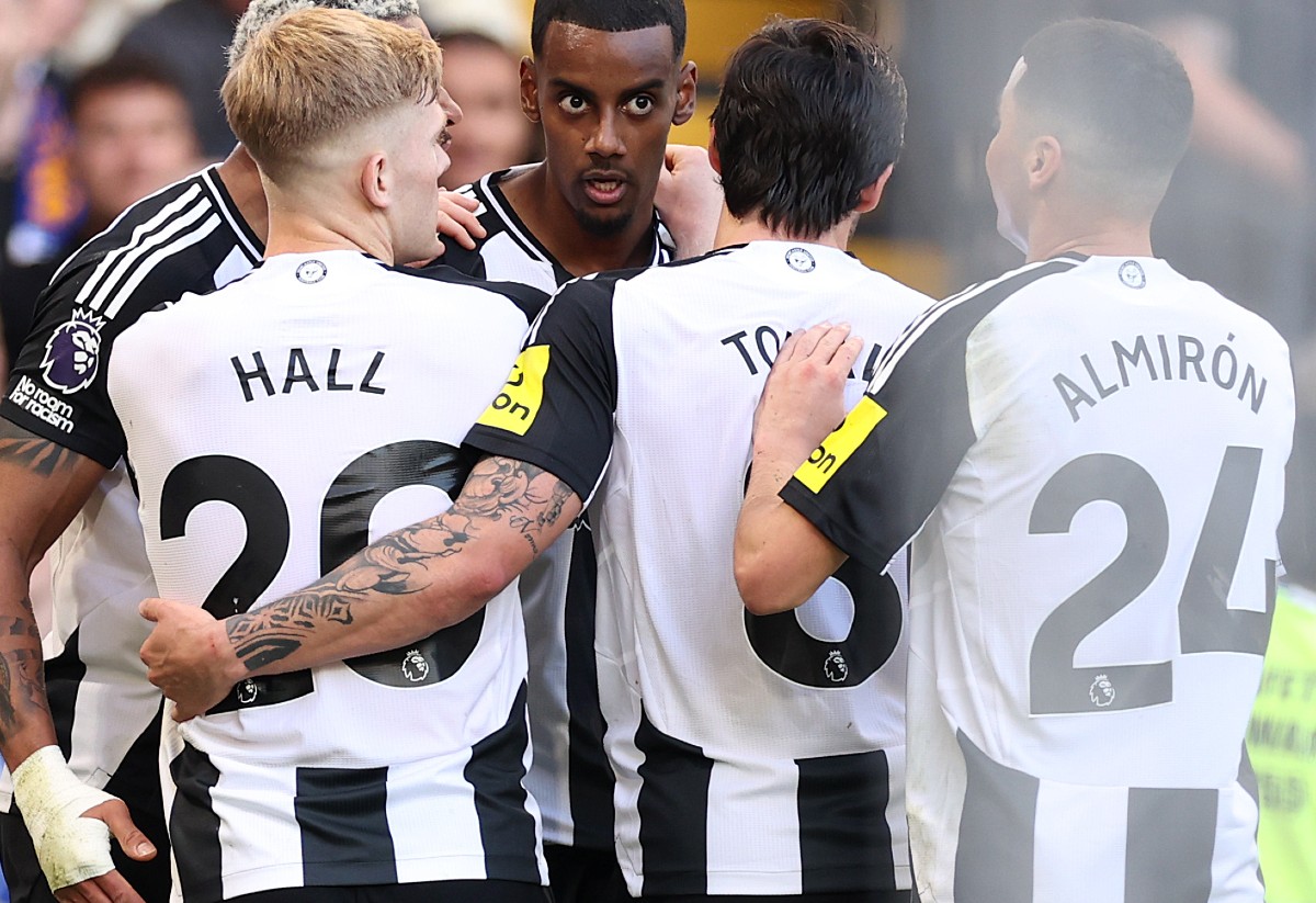 Newcastle players celebrate together