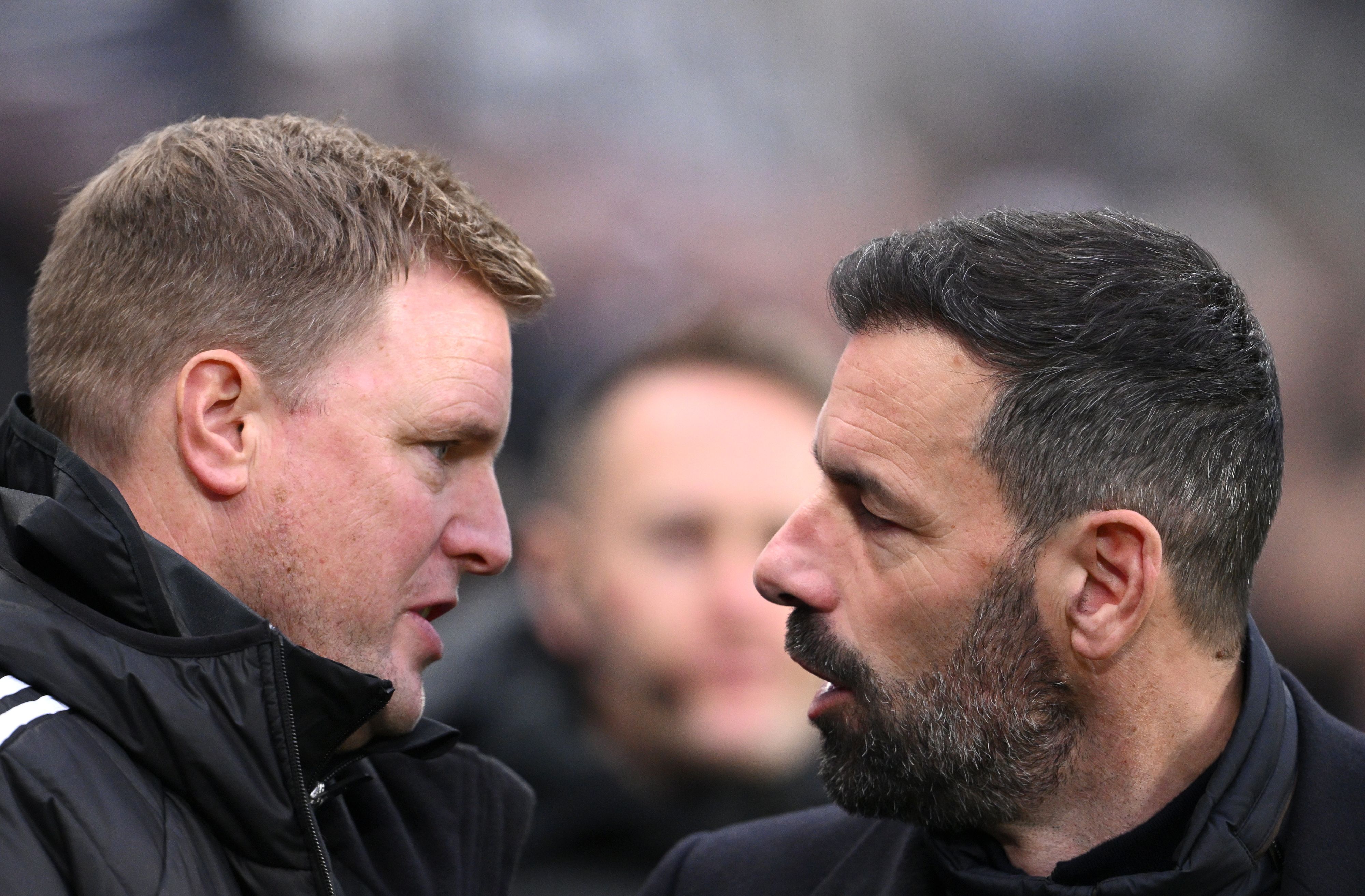 Newcastle head coach Eddie Howe chats with Leicester City manager Ruud Van Nistelrooy