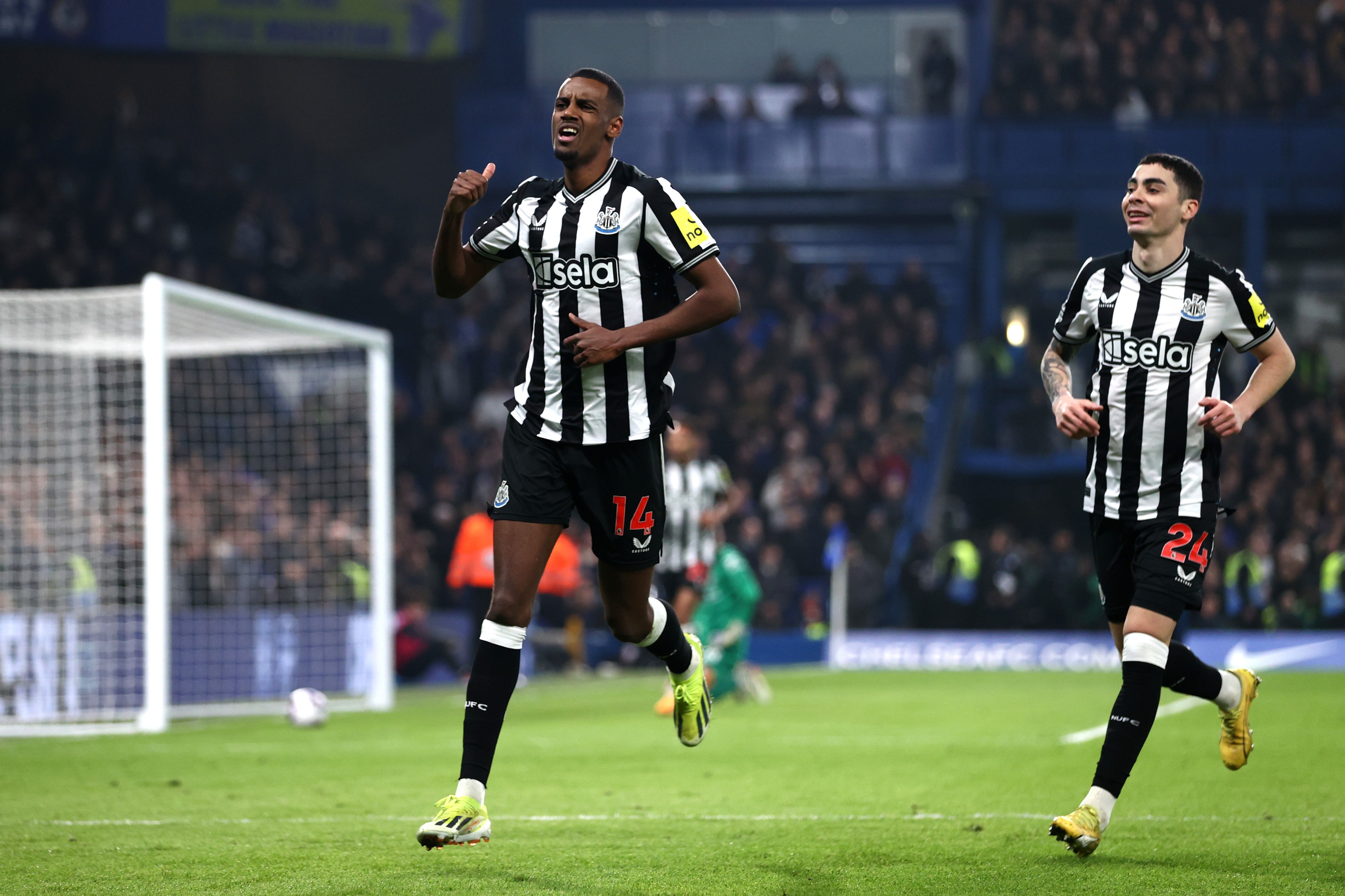 Alexander Isak of Newcastle United celebrates scoring his team's first goal with team-mate Miguel Almiron