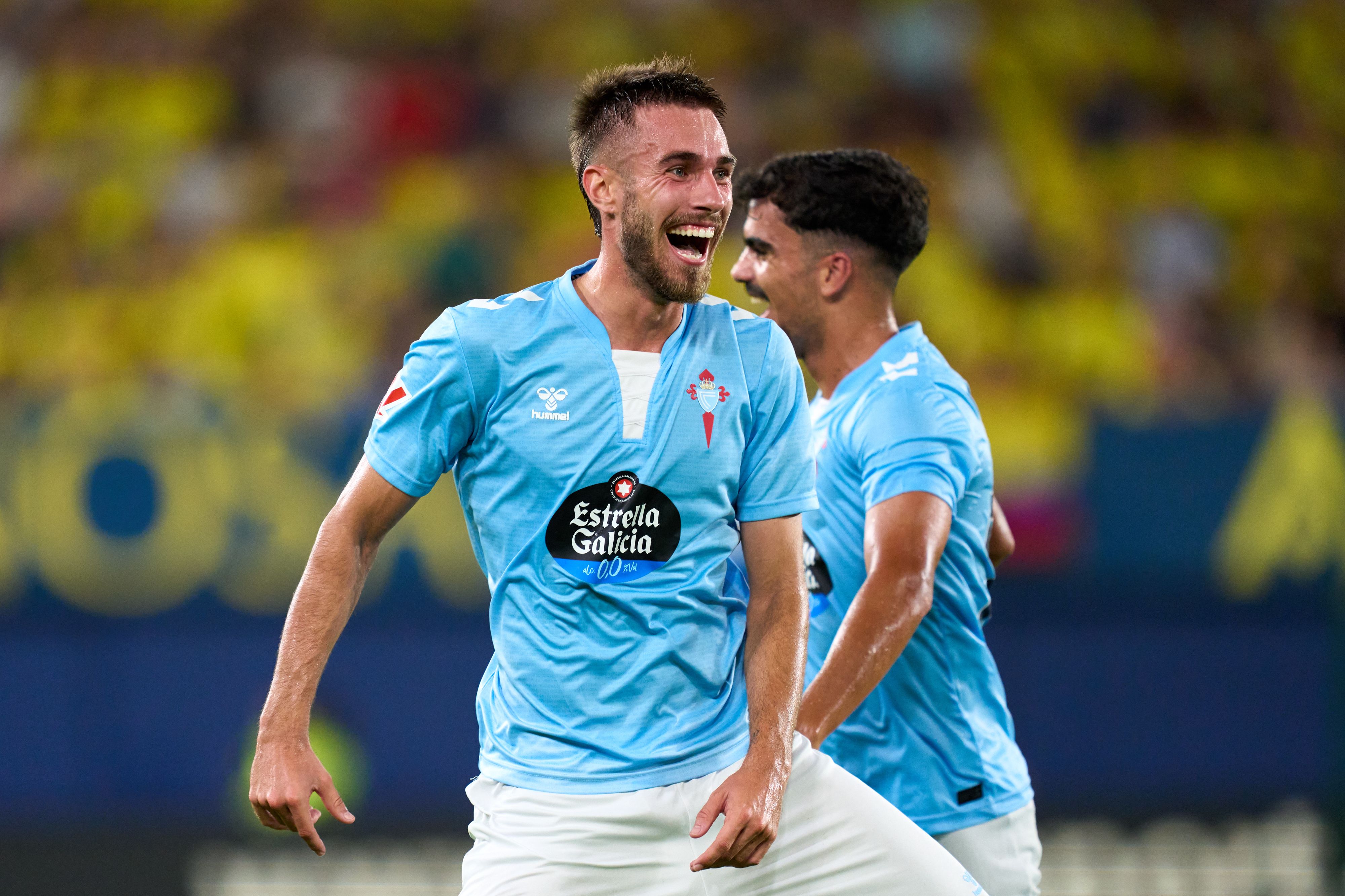 Oscar Mingueza celebrates a goal
