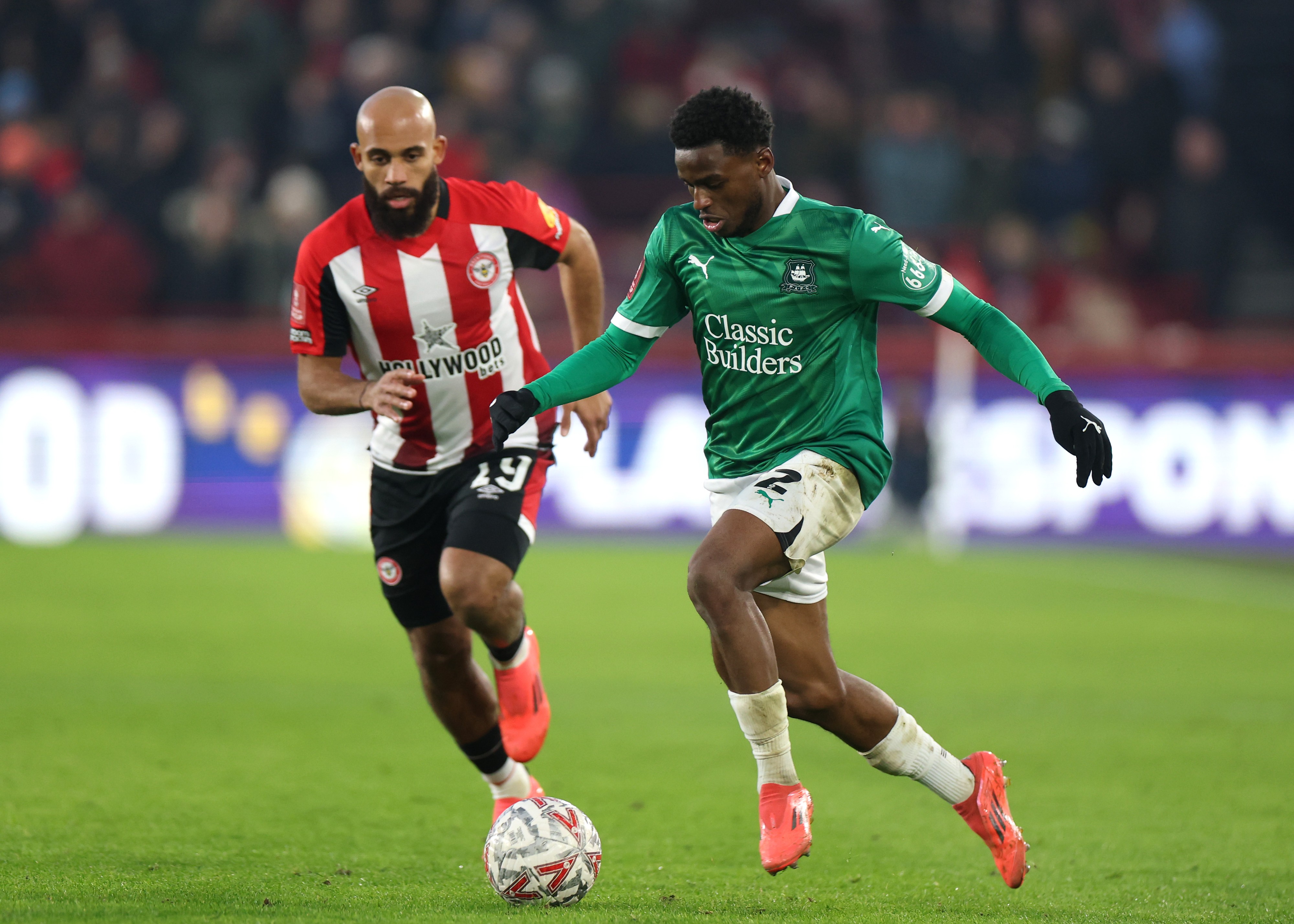 Bali Mumba of Plymouth Argyle runs with the ball