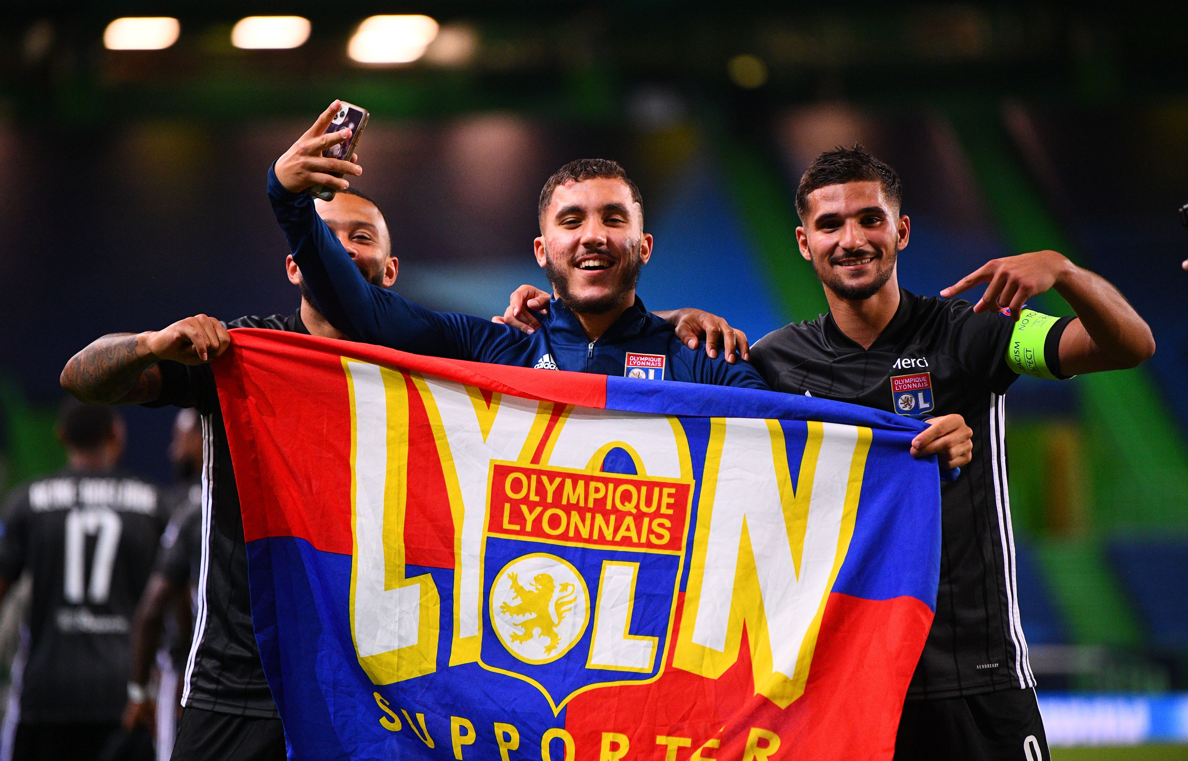 Memphis Depay, Rayan Cherki and Houssem Aouar of Lyon celebrate