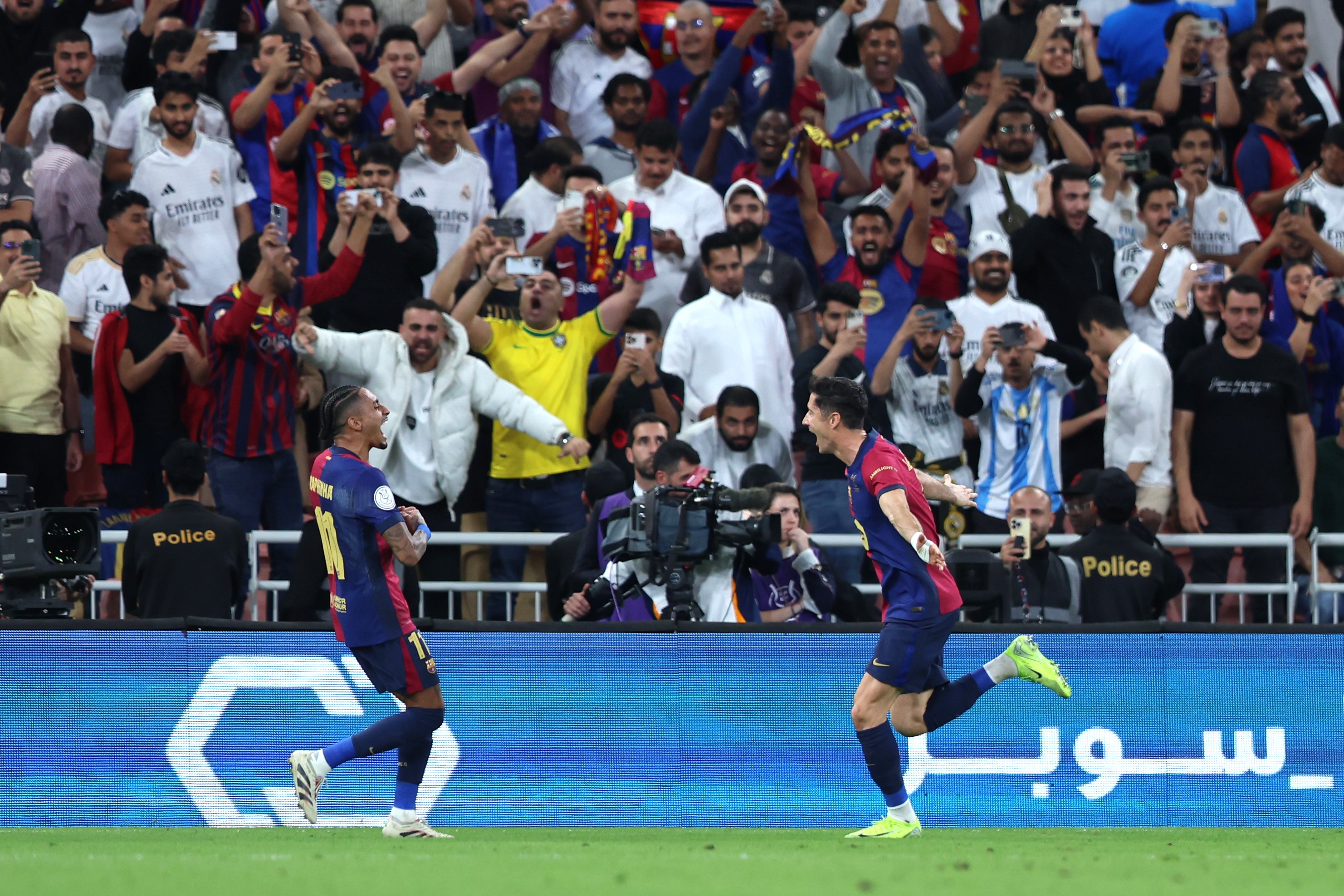 Robert Lewandowski of FC Barcelona celebrates scoring his team's second goal with team mate Raphinha